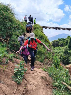 Group of friends enjoying an outdoor scavenger hunt hike in Kenya